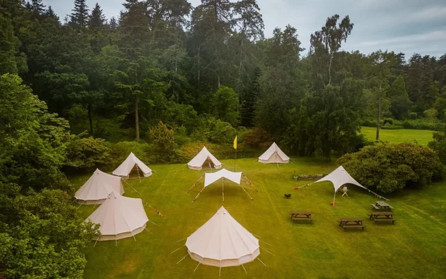 Drone view of the Krankenhaus Festival glamping village in the trees