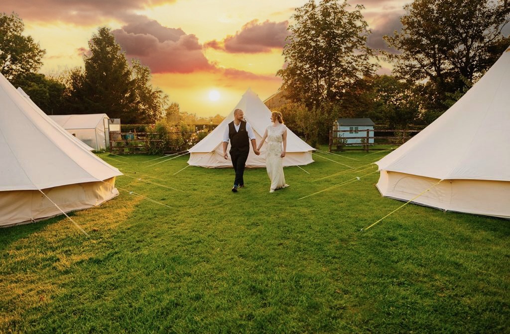 Wedding couple outside their bell tent