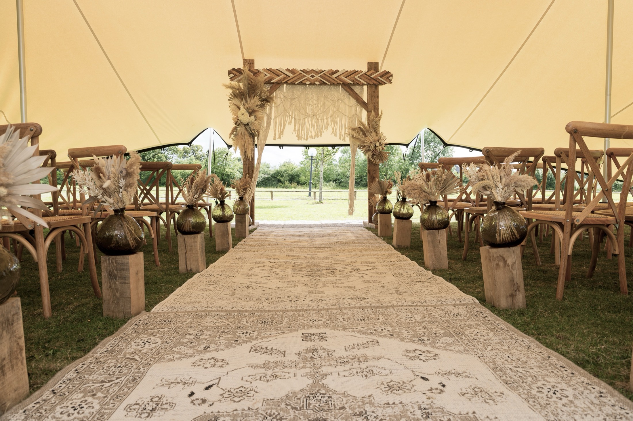 Stretch tent for outdoor wedding with floral decorations